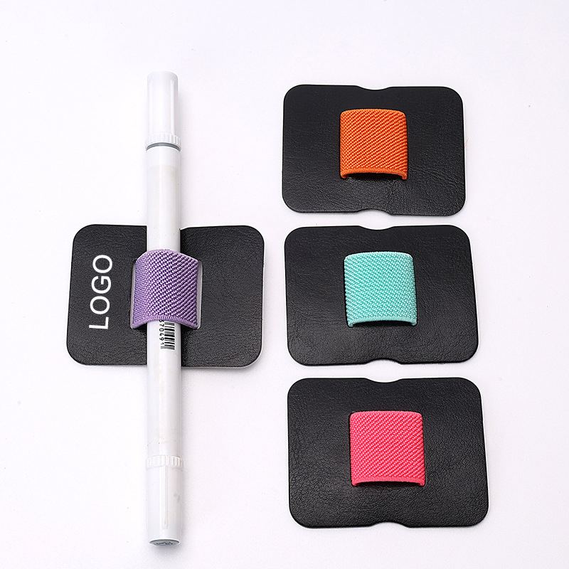 The pen loop holder boasts a powerful adhesive on its back